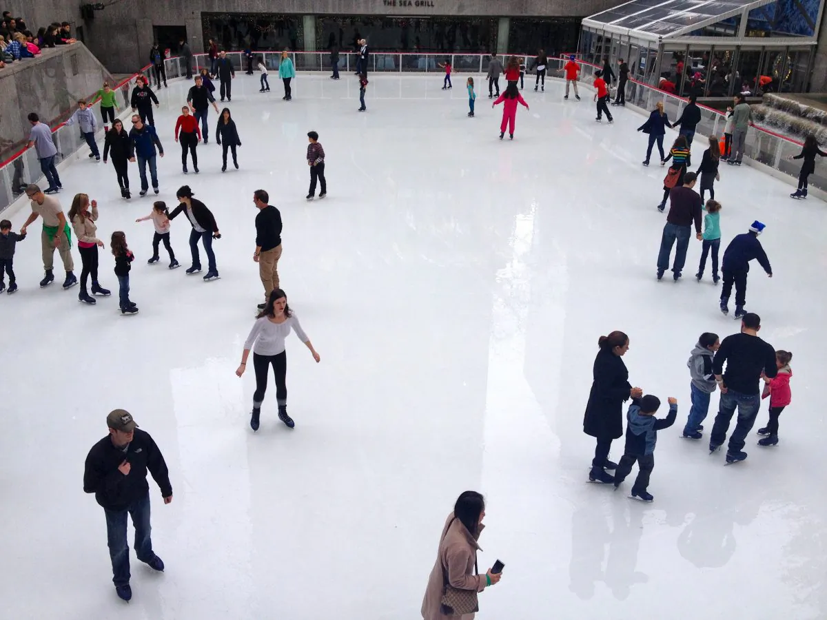 People skate at the ice rink at the Rockefeller Center in New York on Dec. 22. (Kristina Skorbach/The Epoch Times)