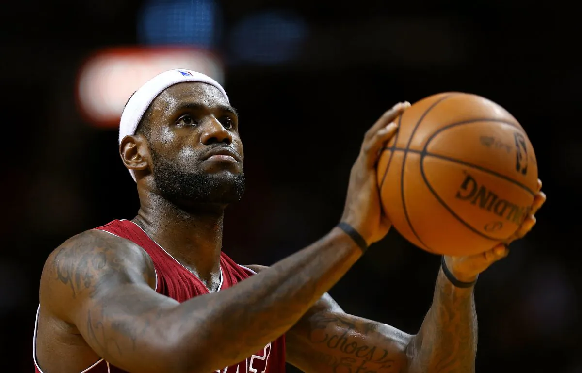 LeBron James #6 of the Miami Heat shoots a foul shot during a game against the Phoenix Suns at American Airlines Arena on November 25, 2013 in Miami, Florida. (Mike Ehrmann/Getty Images) 