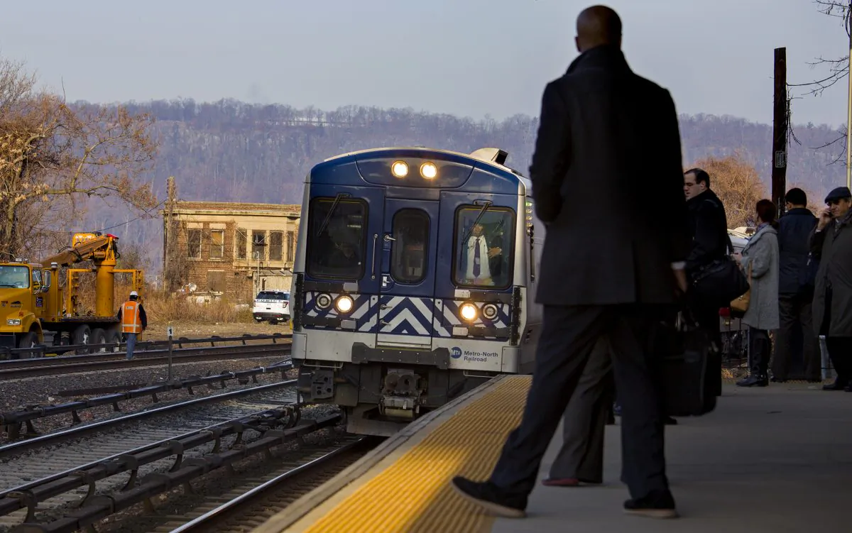 A Metro-North passenger train pulls into the Spuyten Duyvil station in the Bronx, New York on Dec. 4, 2013. (Craig Ruttle/AP)