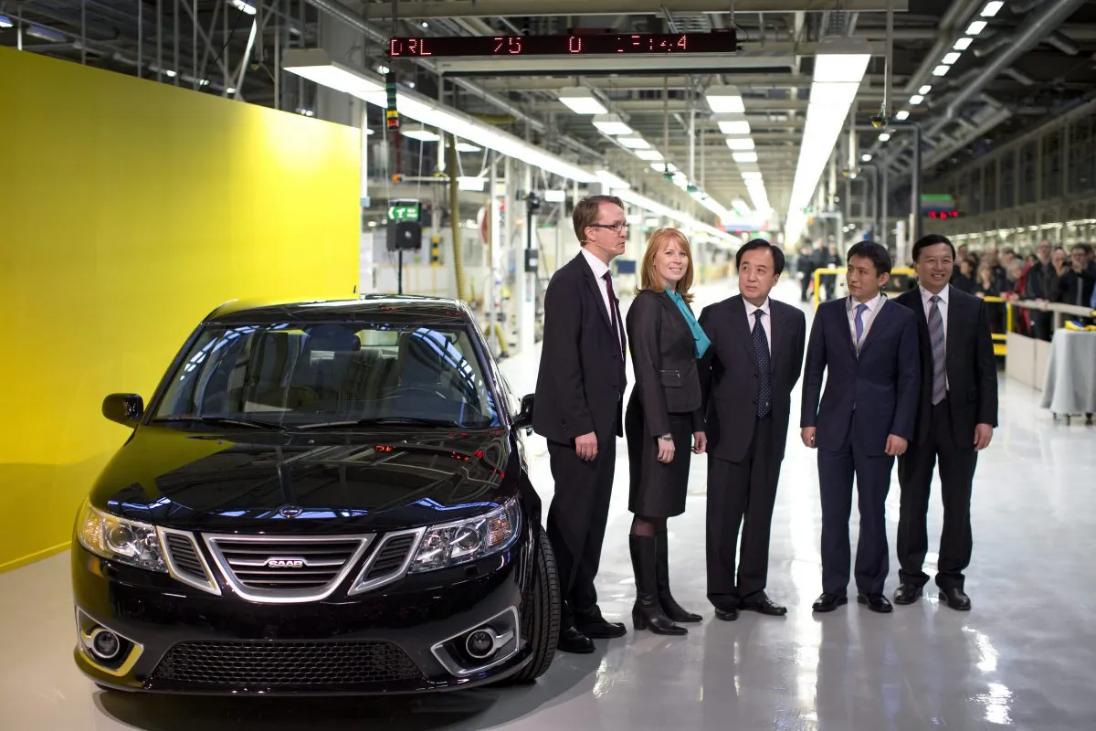 From left: Nevs MD, Mattias Bergman, Swedish Minister of Trade, Annie Loof, China's Ambassador to Stockholm, Chen Yuming, vice mayor of Xingdao Li Chenggang and State Power Group CEO Kai Johan Jiang stand next to the first production Nevs (National Electric Vehicle Sweden) Saab 9-3 Aero at the Trollhattan factory in Sweden, Monday, Dec. 2, 2013. (AP Photo/TT, Bjorn Larsson Rosvall)