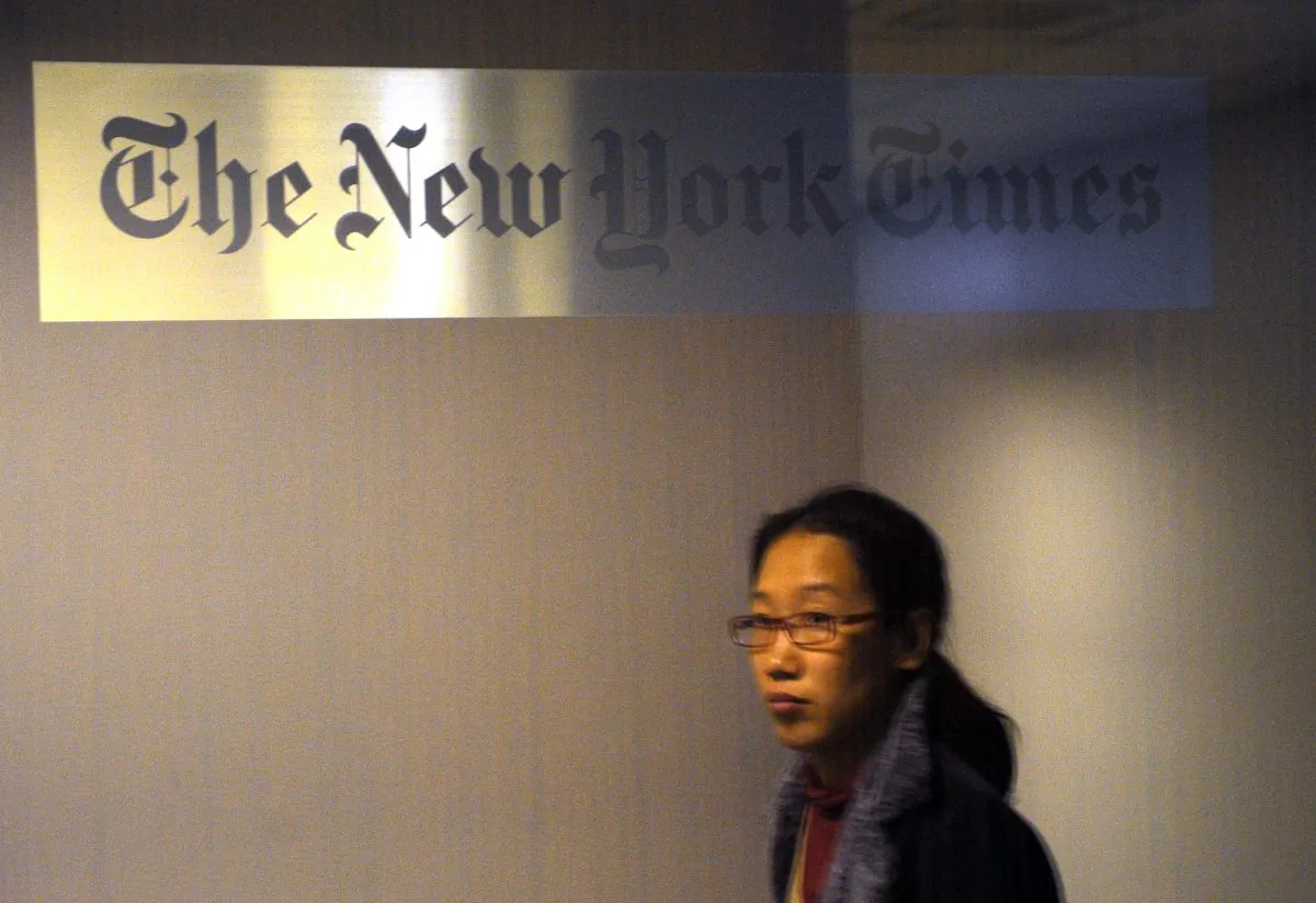 A woman walks past the New York Times office in Shanghai on Oct. 30, 2012, not long after the Times published an article about the wealth of the family of Chinese Premier Wen Jiabao. (Peter Parks/AFP/Getty Images)