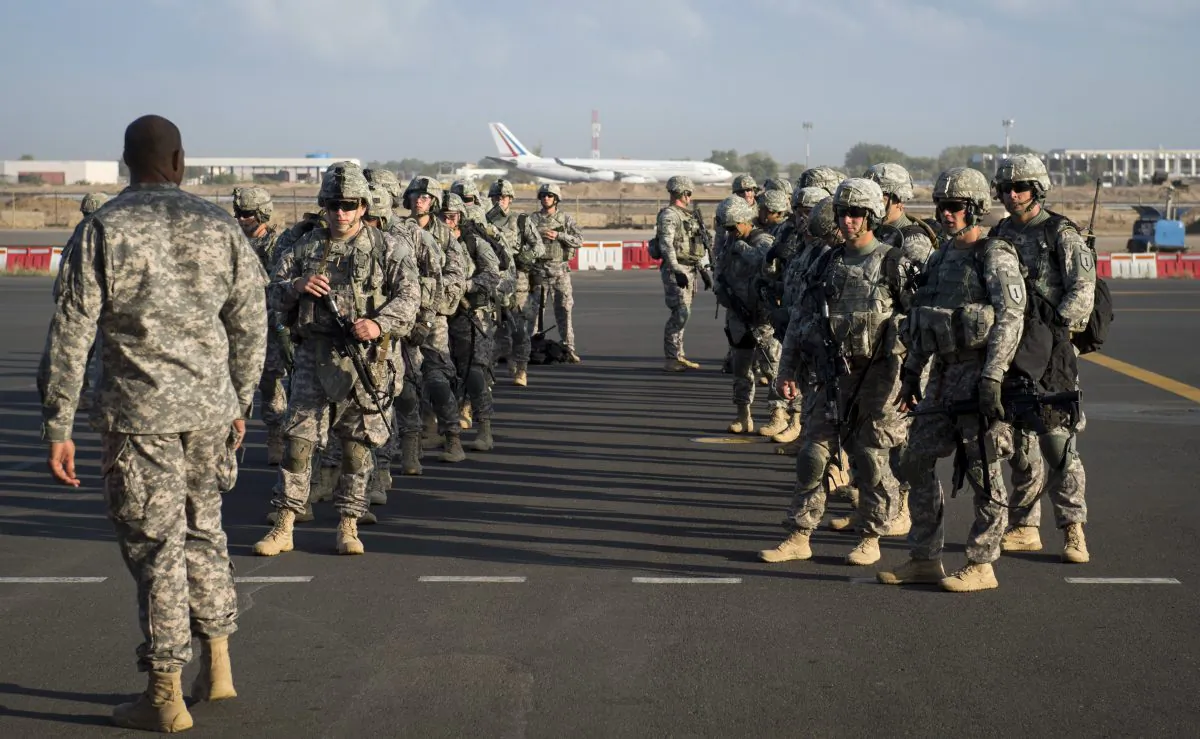 Soldiers of the East Africa Response Force (EARF), a Djibouti-based joint team assigned to Combined Joint Task Force-Horn of Africa, prepare to load onto a U.S. Air Force C-130 Hercules at Camp Lemonnier, Djibouti, to support with an ordered departure of personnel from Juba, South Sudan on Dec. 18, 2013. (U.S. Air Force, Tech. Sgt. Micah Theurich/AP Photo)