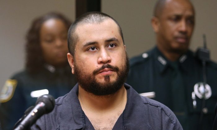 George Zimmerman, the ex-neighborhood watch volunteer was acquitted in the death of teen Trayvon Martin last year, isn’t dead. A fake article said he died. George Zimmerman, acquitted in the high-profile killing of unarmed black teenager Trayvon Martin, listens in court, in Sanford, Fla., during his hearing on charges including aggravated assault stemming from a fight with his girlfriend. The charges were later dropped. (AP Photo/Orlando Sentinel, Joe Burbank, Pool, File)