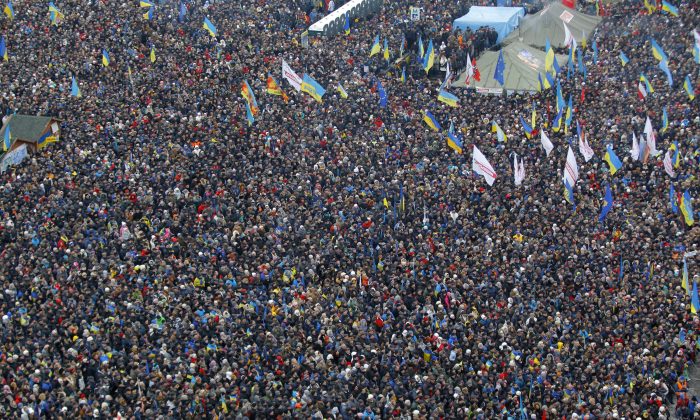 About 200,000 anti-government demonstrators gather during a rally in Independence Square in Kyiv, Ukraine, Dec. 15, 2013. The opposition’s morale remains strong after nearly four weeks of daily protests. (AP Photo/Sergei Grits)