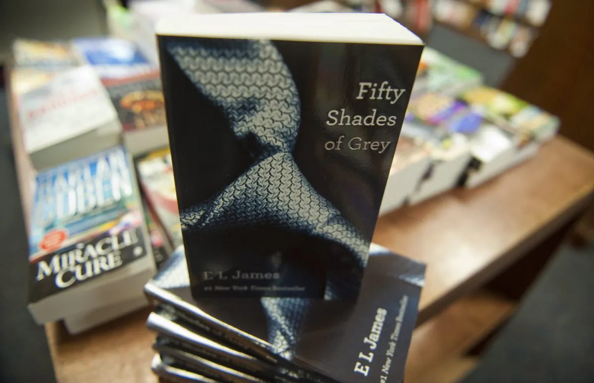Copies of the book 'Fifty Shades of Grey' by E. L. James are seen for sale at the Politics and Prose Bookstore in Washington, DC, August 3, 2012. The first part of an erotic trilogy, the book has spent the past 22 weeks in the number one spot of the New York Times bestseller's list for fiction. AFP PHOTO / Saul LOEB (Photo credit should read SAUL LOEB/AFP/GettyImages)
