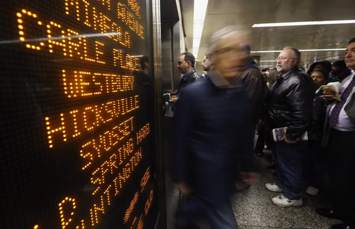 People wait to board a Long Island Rail Road (LIRR) train in Penn Station during the morning rush on Nov. 2, 2012 in New York City. (Mario Tama/Getty Images)