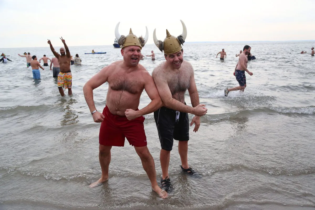 Participants of the New Year's Day Coney Island Polar Bear Plunge pose after a chilly plunge at Coney Island Beach, Brooklyn, New York, Jan. 1, 2014. (Christian Watjen/Epoch Times)