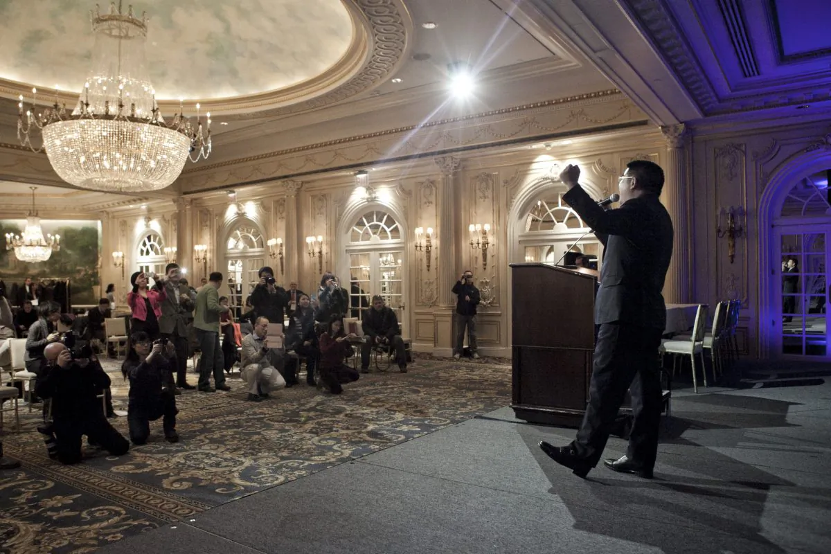 Chen Guangbiao speaks to the press at a news conference he called for the morning of Tuesday, Jan. 7, in a hotel in New York City. The event featured Chen singing karaoke and introducing claims against Falun Gong, a spiritual practice, that mirror official Chinese propaganda. (Samira Bouaou/Epoch Times)