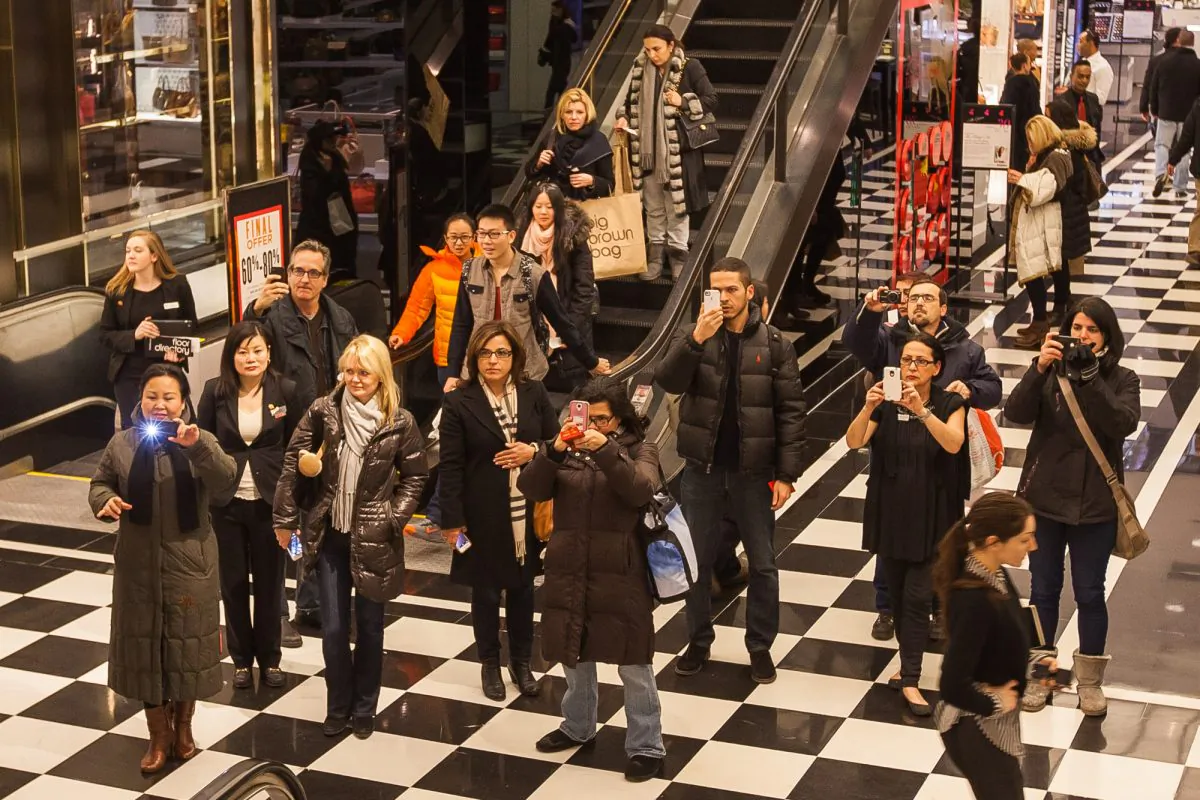 Shoppers take photos of Lunar New Year displays inside Bloomingdale’s on 59th Street, Jan. 30, 2014. (Petr Svab/Epoch Times)