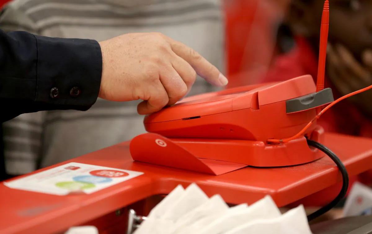 A customer uses a credit card terminal at a Target store in Miami, Fla., Dec. 13, 2013. Information from more than 40 million credit cards was stolen from the retail giant between November 27 and December 15 in one of the biggest data breaches in corporate history. 