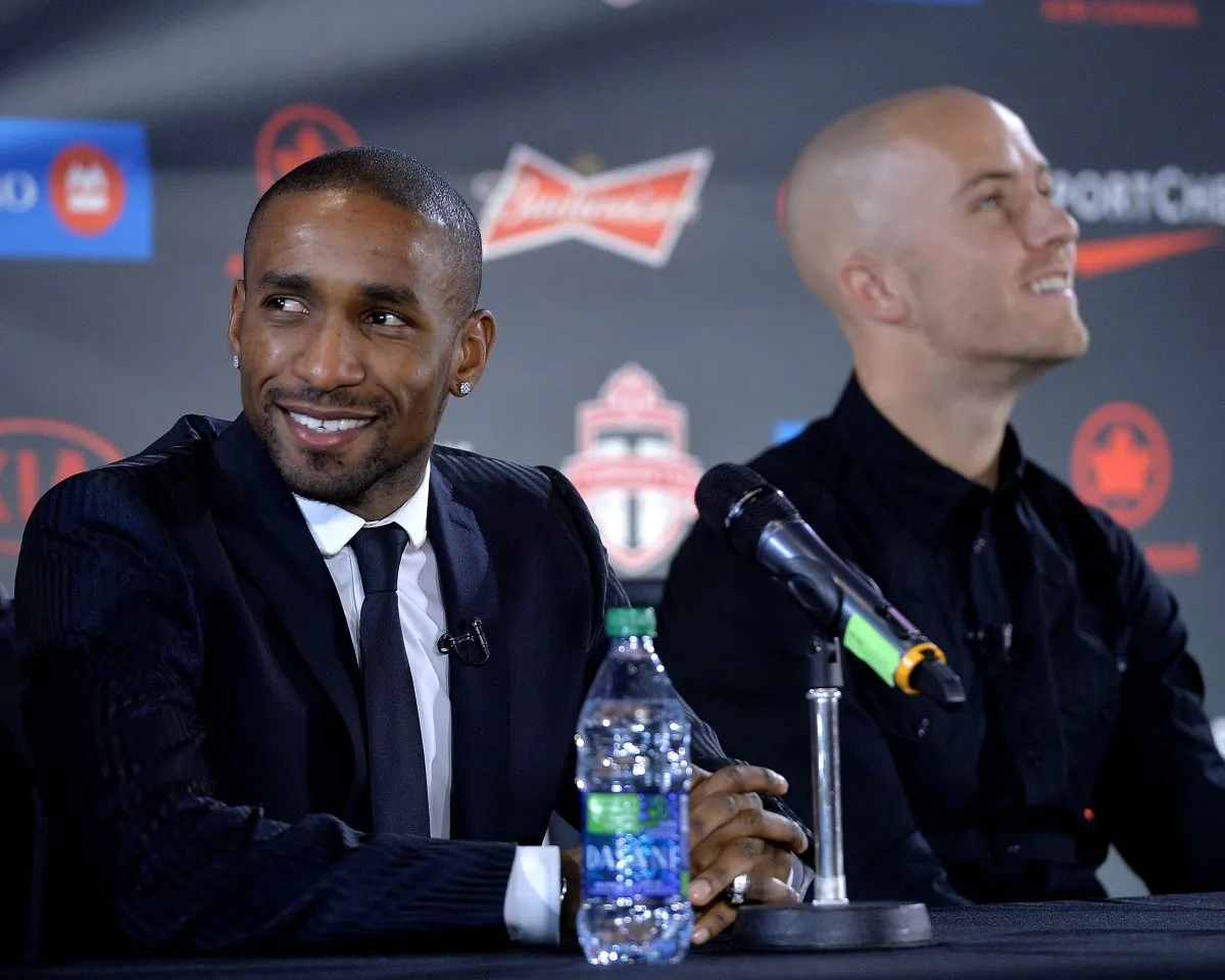 Toronto FC’s two newest designated player signings Jermain Defoe (L) and Michael Bradley survey the crowd at a press conference in Toronto on Jan. 13, 2014.
(Jag Gundu/Getty Images)