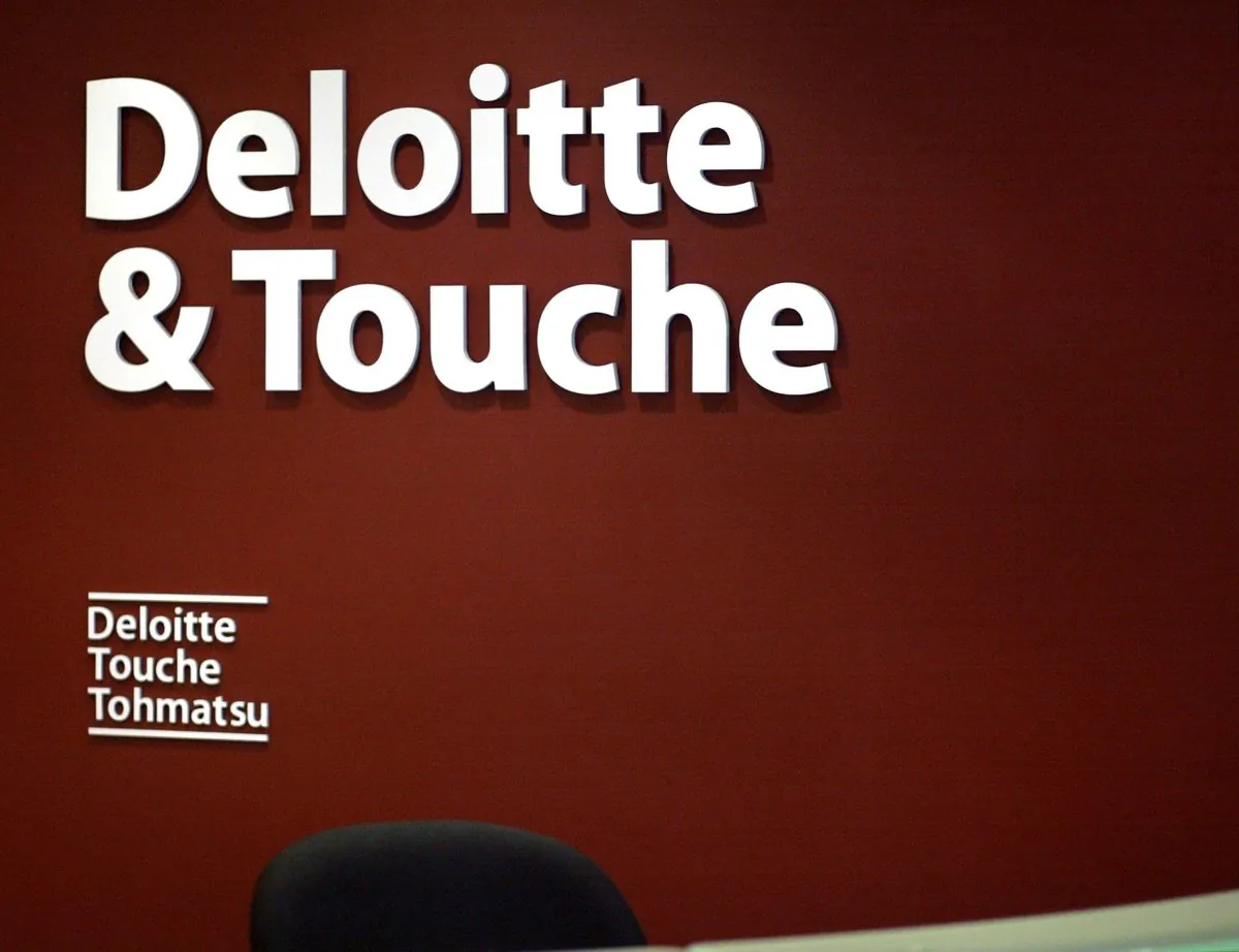 Deloitte-China agreed to pay a $20 million fine to settle charges with the U.S. Securities and Exchange Commission that the firm asked its clients to conduct their own audit work. (Tim Boyle/Getty Images)