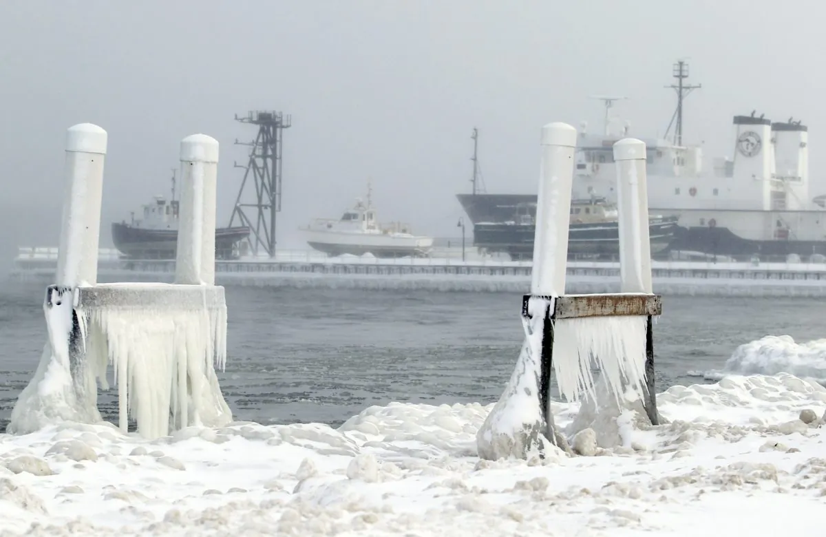 In this Jan. 7, 2014 photo ice forms on parts of a dock on West Grand Traverse Bay near the Great Lakes Maritime Academy in Traverse City, Mich. (AP Photo/ Traverse City Record-Eagle, Keith King, File) MANDATORY CREDIT