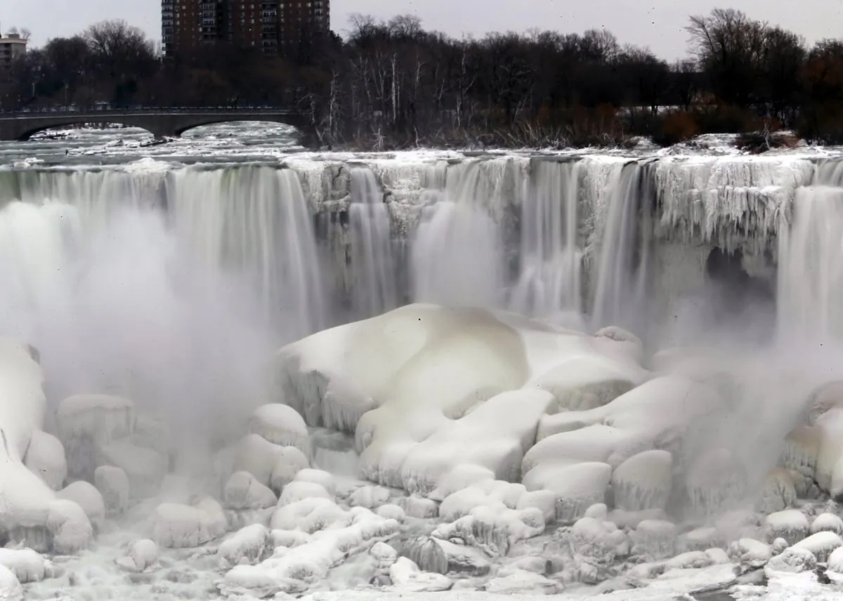 The U.S. side of Niagara Falls is thawing after being frozen solid from the recent polar vortex early January, in Niagara Falls, N.Y., Jan. 10, 2014. New York state is promoting tourists sites outside of New York City like the falls. (Nick LoVerde/AP)