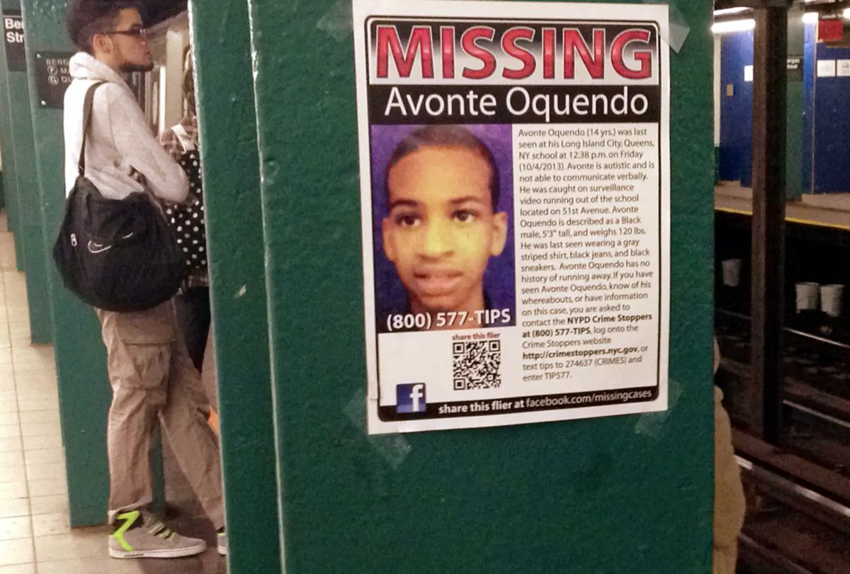 In this Oct. 21, 2013 file photo, a missing poster asking for help in finding Avonte Oquendo is displayed at a subway station in the Brooklyn borough of New York. Oquendo, 14, who is autistic, was last seen on Oct. 4 walking out of his Queens school. (AP Photo/Barbara Woike)