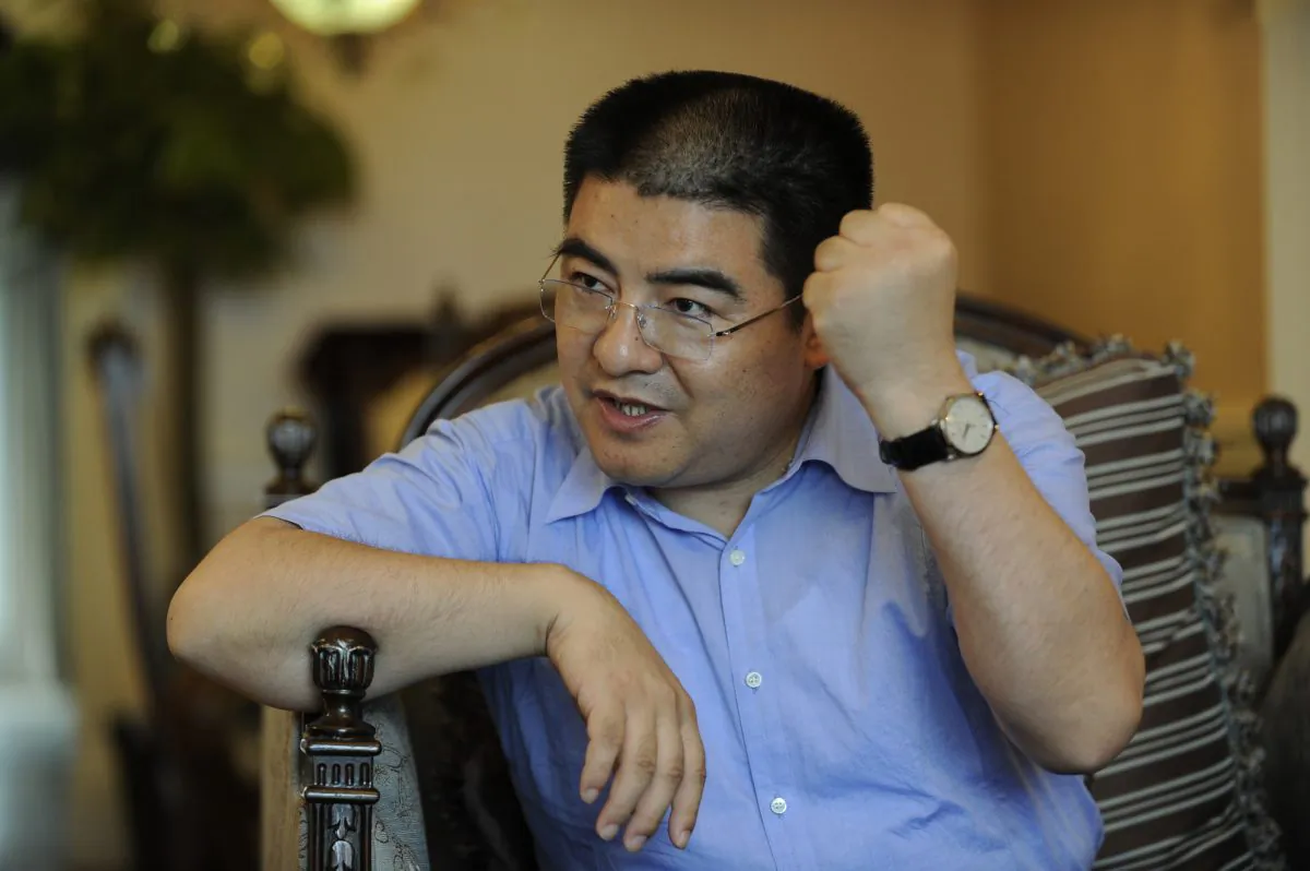 Chen Guangbiao gesticulates in an interview on Sept. 16, 2010 in Beijing. (Peter Parks/AFP/Getty Images)