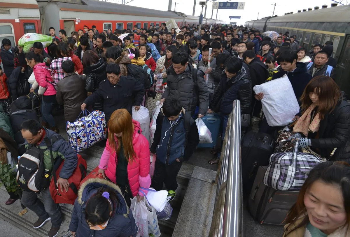 Passengers crowd on a stairway as they head to an underpass after disembarking from trains at a railway station in Fuyang in central China's Anhui province on Thursday, Jan. 16, 2014. Although the New Year travel period only started Thursday and will last 40 days, people are already complaining about tickets not being available. (AP Photo)