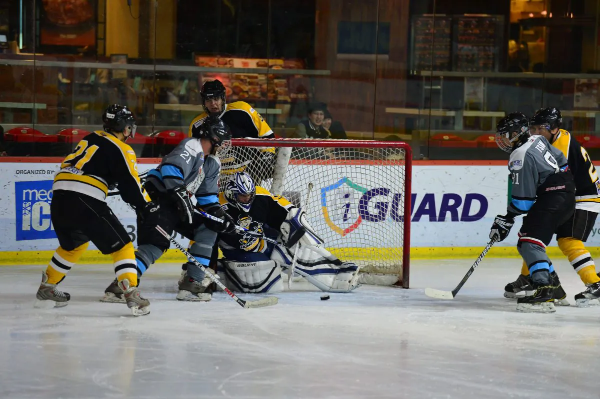Julien Jorand on the attack for South China Sharks in their CIHL match against Hong Kong Tycoons at Mega Ice on Saturday Jan 18, 2014. The Sharks won 13-nil. (Bill Cox/Epoch Times)