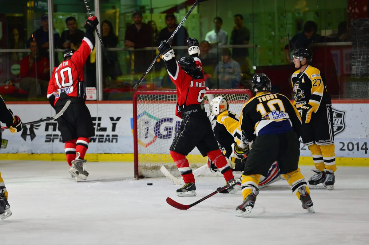 Kowloon Warriors celebrate after snatching victory with an overtime goal in their match against Hong Kong Tycoons in their CIHL at Mega Ice on Saturday Jan 11, 2014. (Bill Cox/Epoch Times)