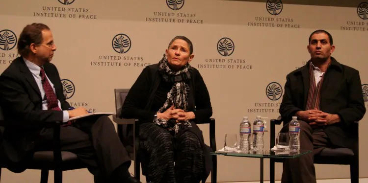 Steve Riskin (L) moderates a discussion with Robi Damelin (C), and Bassam Aramin (R) following the screening of a new documentary on the Arab-Israeli conflict titled, “Two Sided Story,” at the United States Institute of Peace (USIP) in Washington, D.C., on Feb. 7, 2013. Damelin, an Israeli, and Aramin, a Palestinian, are active in promoting peace and reconciliation, particularly through dialogue between ordinary people on both sides. (Gary Feuerberg/The Epoch Times)