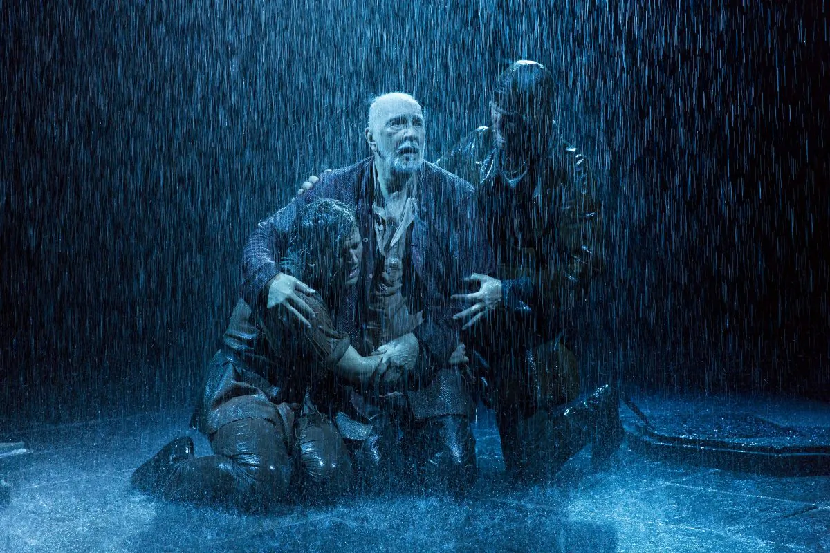 (L–R) The Fool (Harry Melling), King Lear (Frank Langella), and Kent (Steven Pacey) suffering the blowing winds that “crack your cheeks!” (Richard Termine)