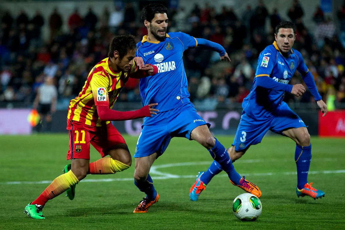 Neymar Jr. (L) of FC Barcelona competes for the ball with Angel Lafita (R) of Getafe CF during the Copa del Rey Round of 8 second leg match between Getafe CF and FC Barcelona at Coliseum Alfonso Perez in Getafe, Spain, on Jan. 16, 2014. (Gonzalo Arroyo Moreno/Getty Images)