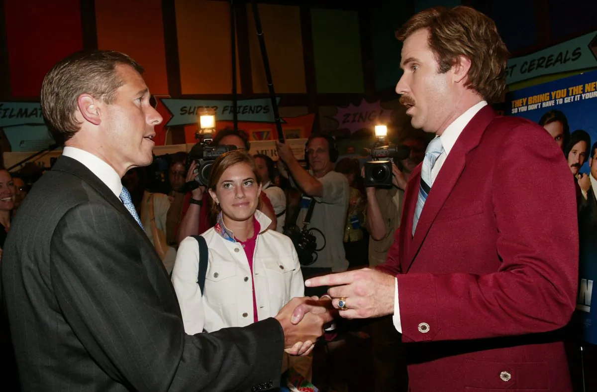 NBC News Anchor Brian Williams chats with actor Will Ferrell aka Ron Burgundy after a special screening of the film “Anchorman: The Legend of Ron Burgundy” in New York on July 7, 2004. (Evan Agostini/Getty Images)