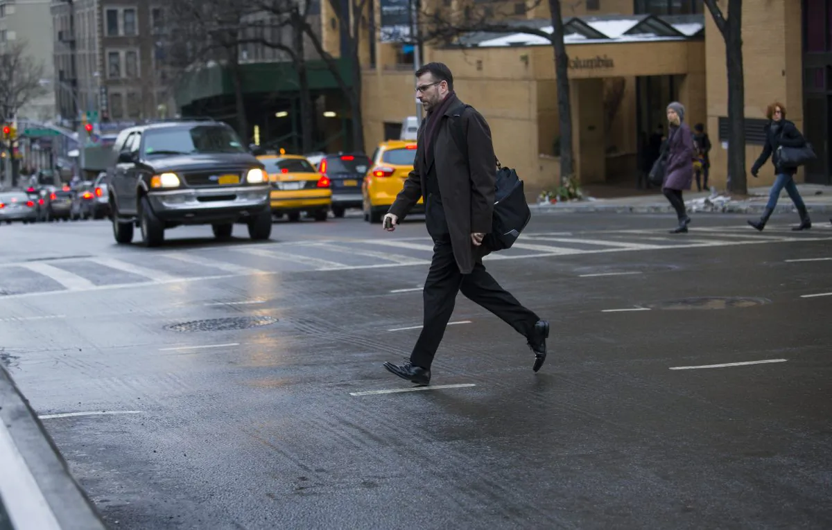 A Pedestrian moves quickly outside of a crosswalk at the busy intersection of W. 96th Street and Broadway in the Upper West Side of New York City on Jan. 27, 2014.

(AP Photo/Craig Ruttle)
