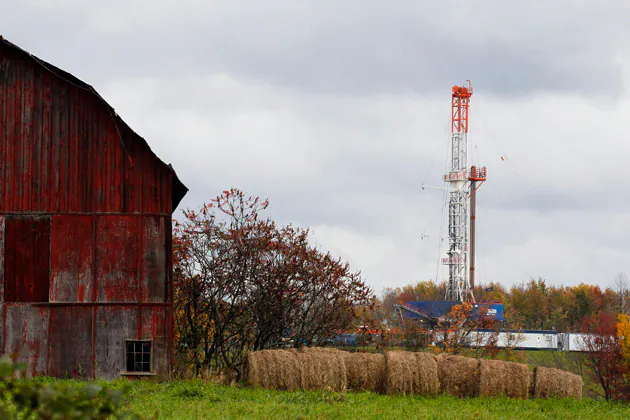 A drilling rig in Springville, Pa. Income from oil and gas production doesn’t always trickle down to landowners, as companies find ways to minimize the share they pay in royalties. (AP Photo/ Alex Brandon)