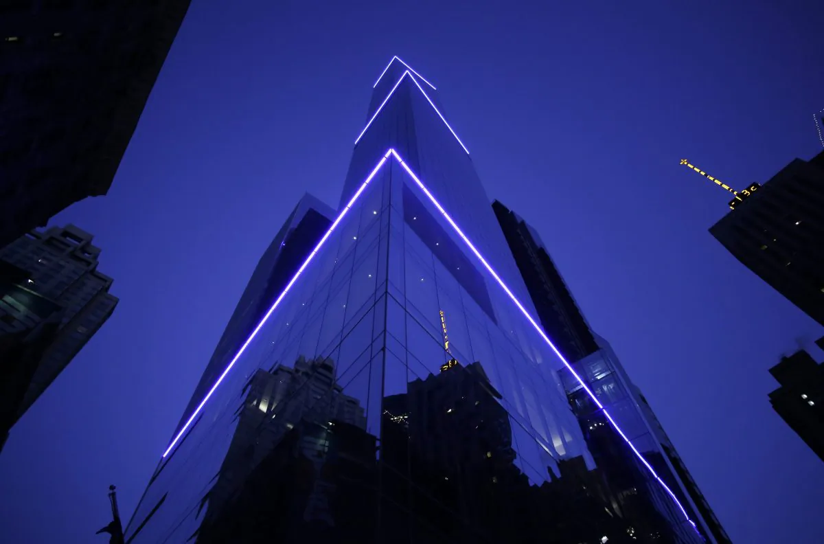 The 68-story Marriott Courtyard-Residence Inn Central Park is illuminated early Wednesday, Jan. 8, 2014, in New York. City hotels saw a 4.4 percent increase in occupancy in 2013, in part boosted by homeless Superstorm Sandy victims. (AP Photo/Mark Lennihan)