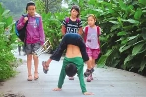 Paraplegic Boy Walking to School on his Hands Is Testament to the Indomitable Human Spirit