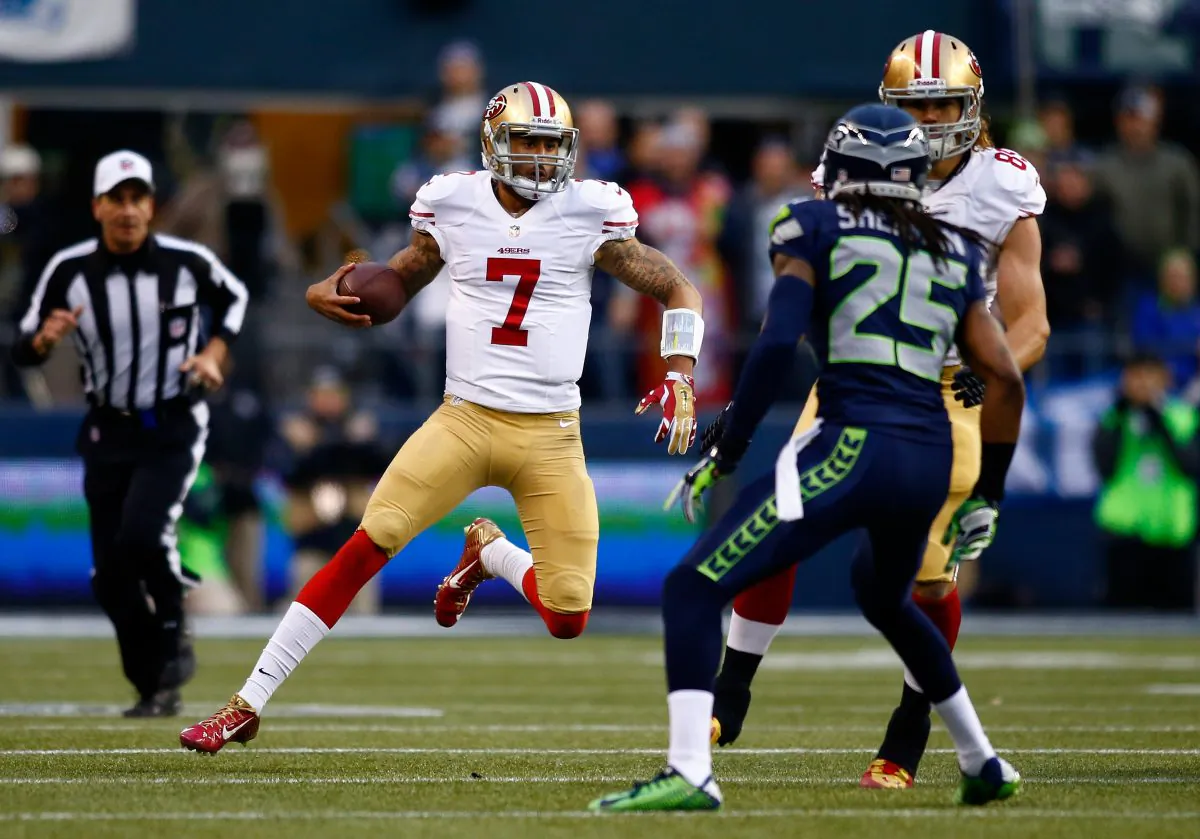 Quarterback Colin Kaepernick #7 of the San Francisco 49ers runs the ball in the first half against the Seattle Seahawks during the 2014 NFC Championship at CenturyLink Field in Seattle, Washington, January 19, 2014. Kaepernick’s 98 yards rushing gave San Francisco the edge. (Jonathan Ferrey/Getty Images)