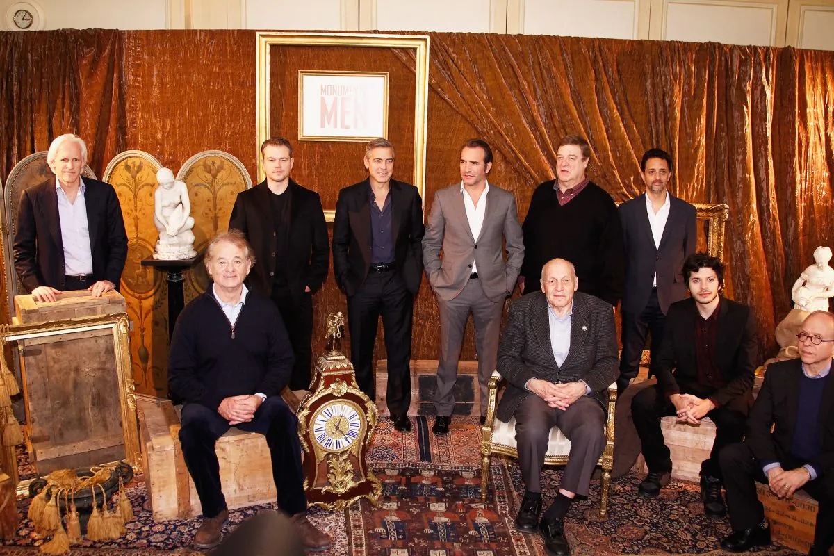 (L-R) Writer Robert M. Edsel, actors Bill Murray, Matt Damon, George Clooney, Jean Dujardin, 'Real Monument Man' Harry Hettlinger, actor John Goodman, producer Grant Heslov, actors Dimitri Leonidas and Bob Balaban attend the 'Monuments Men': Photocall at Hotel Le Bristol on Feb. 12, 2014, in Paris, France. (Julien M. Hekimian/Getty Images)