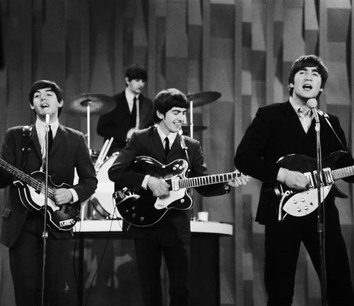 The Beatles perform on the CBS “Ed Sullivan Show” in New York on Feb. 9, 1964. Ringo Starr on drums, playing guitars (L–R) Paul McCartney, George Harrison, and John Lennon. (AP Photo/Dan Grossi/ file)