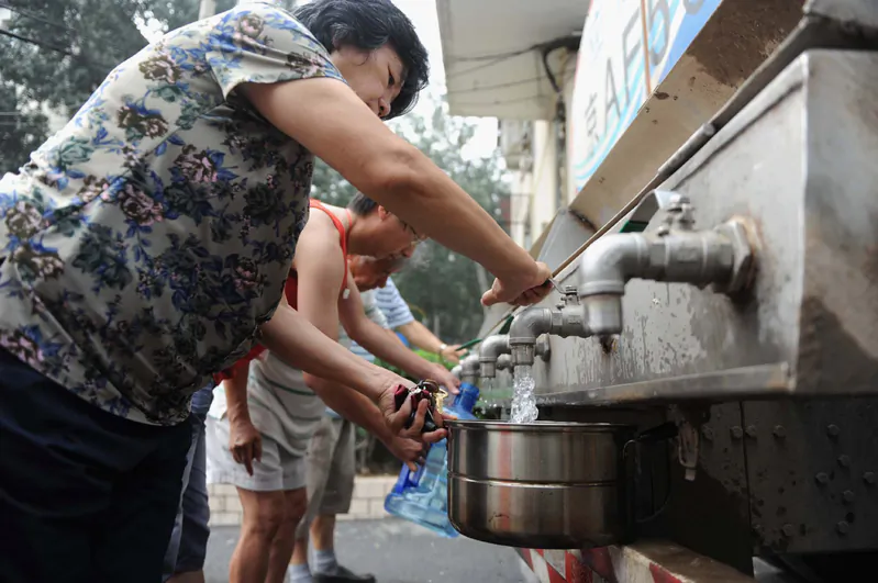 Beijing citizens are filling drinking water. By international definitions, water scarcity is defined at less than 500 cubic meters of water per person per year. Annual water supply in Beijing totals less than 100 cubic meters of water per person, making Beijing’s water shortage worse than that of the Middle East and North Africa. (ChinaFotoPress/Getty Images)