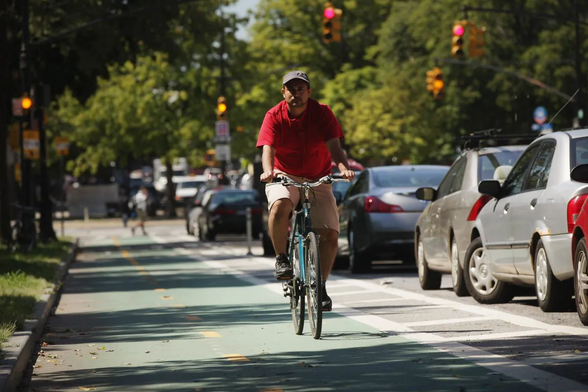 A man rides his bike along a bike lane on Prospect Park West on August 17, 2011 in the Brooklyn borough of New York City. (Spencer Platt/Getty Images)