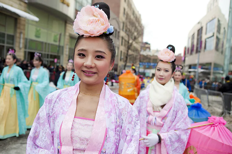 Young women dressed in traditional Chinese gowns walk in the Lunar New Year Parade  in Flushing, New York, on Feb. 8, 2014. (Samira Bouaou/Epoch Times)