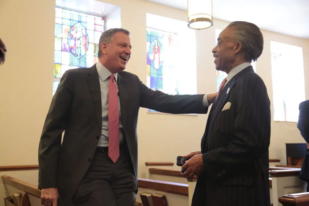 New York City Mayor Bill de Blasio and the Rev. Al Sharpton chat at the Clergy Breakfast to rally ministers in support of universal prekindergarten at Bethany Baptist Church in Brooklyn, New York, Feb. 11, 2014. (Ed Reed/Mayor's Office) 