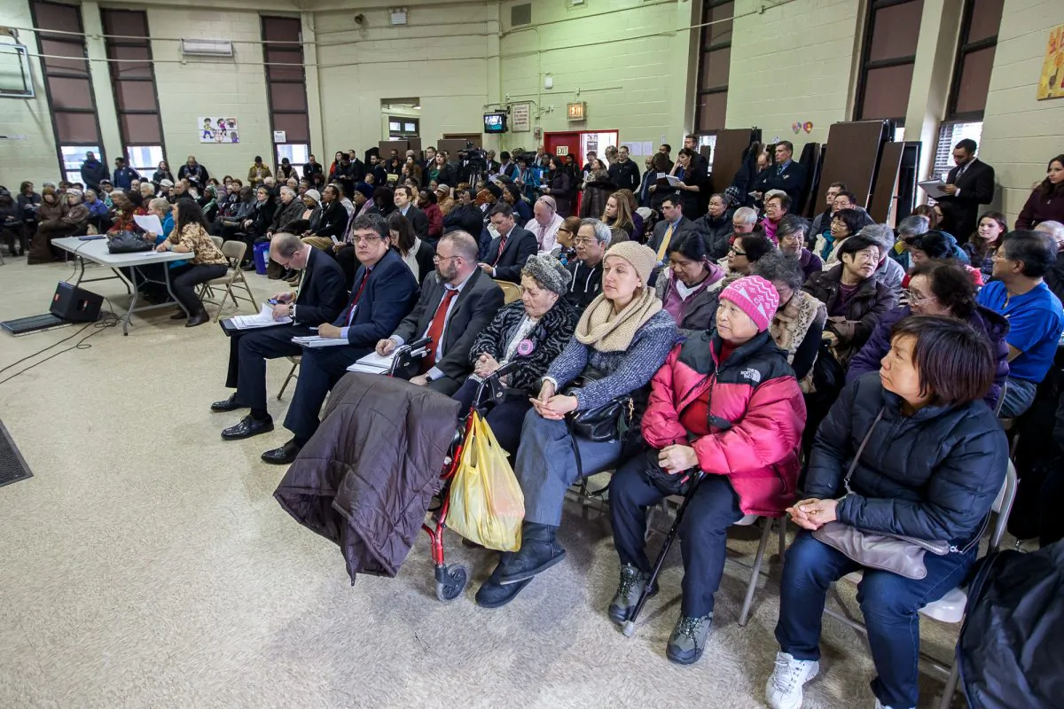 People listen to testimonies during a City Council Public Housing Committee meeting in the Carey Gardens Community Center, Coney Island, New York, Feb. 27, 2014. (Petr Svab/Epoch Times)
