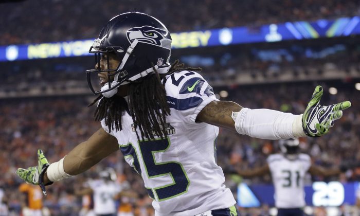 Seattle Seahawks' Richard Sherman (25) reacts during the second half of the NFL Super Bowl XLVIII football game against the Denver Broncos Sunday, Feb. 2, 2014, in East Rutherford, N.J. (AP Photo/Jeff Roberson)