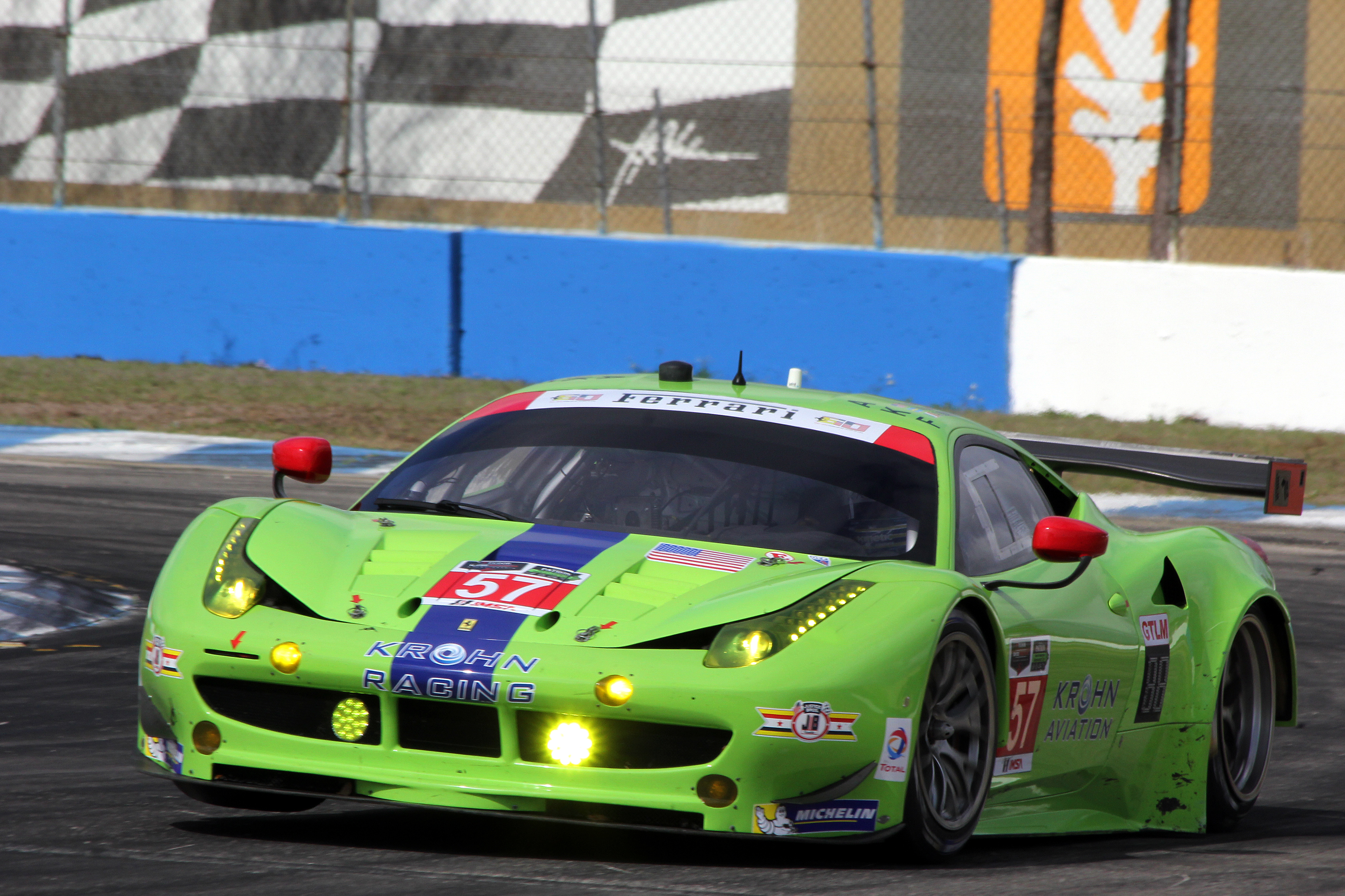 The #57 Krohn Racing Ferrari 458 proves that not only Porsches can lift a wheel around Turn Ten. (Chris Jasurek/Epoch Times) The #57 Krohn Racing Ferrari 458 proves that not only Porsches can lift a wheel around Turn Ten. (Chris Jasurek/Epoch Times)