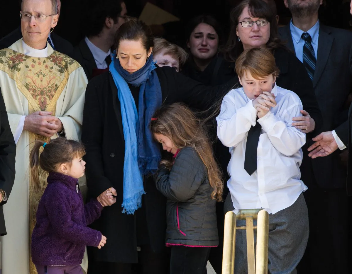 Philip Seymour Hoffman's family, Mimi O'Donnell (C), their children (L-R), Willa Hoffman, Tallulah Hoffman and Cooper Hoffman, at his funeral at St. Ignatius of Loyola in New York, Feb. 7. (Dave Kotinsky/Getty Images)