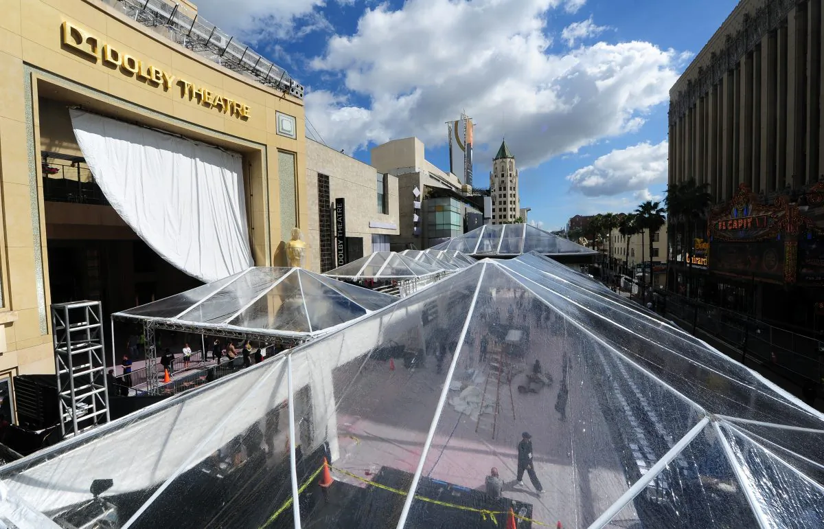 A giant tarp provides the cover for expected rain as preparations continue on a covered-up Red Carpet along Hollywood Boulevard in front of the Dolby Theater on February 27, 2014 in Hollywood, California, for the 86th Academy Awards which take place on Mar. 2. (FREDERIC J. BROWN/AFP/Getty Images)