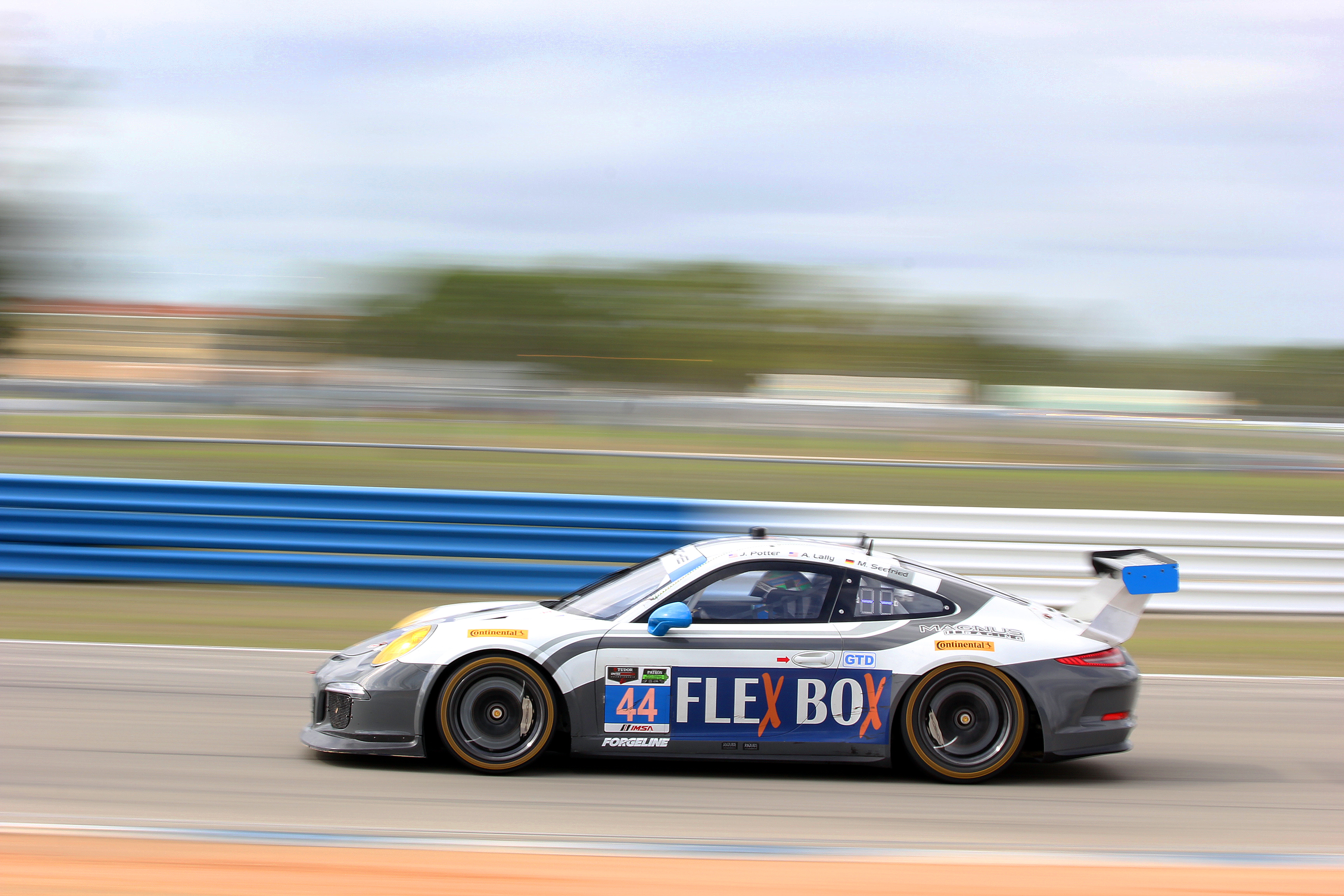 The #44 GTD Magnus Porsche streaks towards Turn 11 Friday morning. (Chris Jasurek/Epoch Times) The #44 GTD Magnus Porsche streaks towards Turn 11 Friday morning. (Chris Jasurek/Epoch Times)