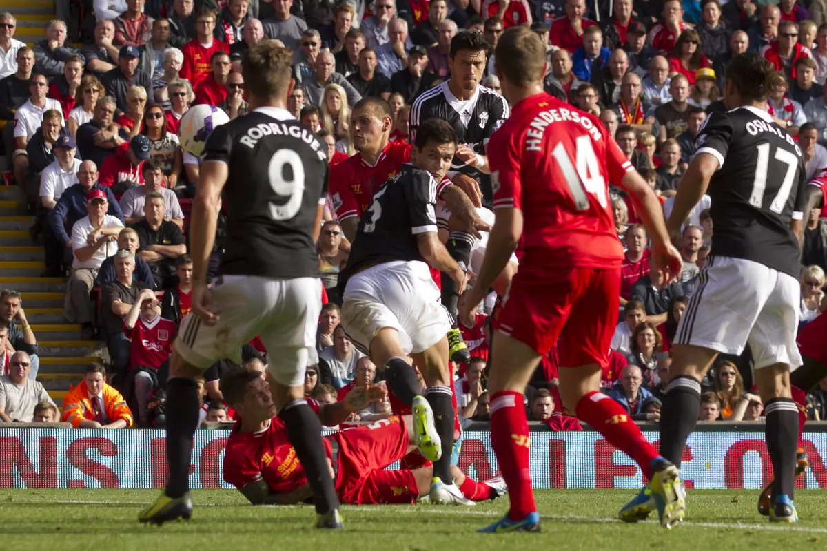 Southampton's Dejan Lovren, centre, scores against Liverpool during their English Premier League soccer match at Anfield Stadium, Liverpool, England, Saturday Sept. 21, 2013. (AP Photo/Jon Super)