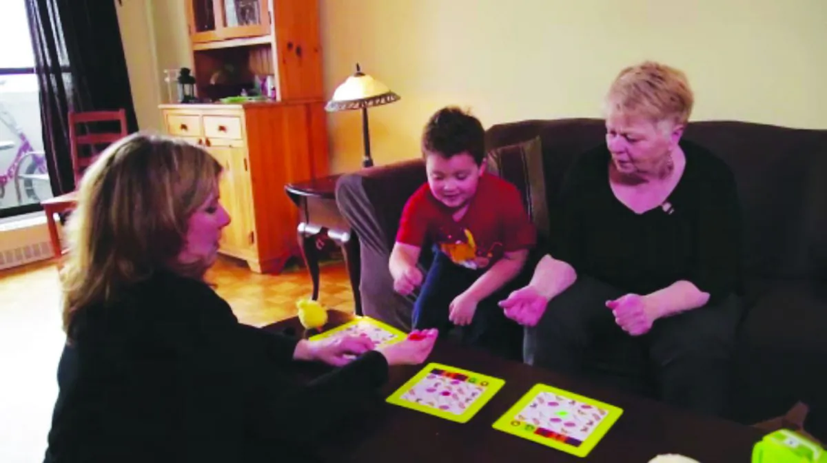 IPF patient Larkell Bradley plays a game with her daughter and 6-year-old grandson. (Courtesy Canadian Pulmonary Fibrosis Foundation)