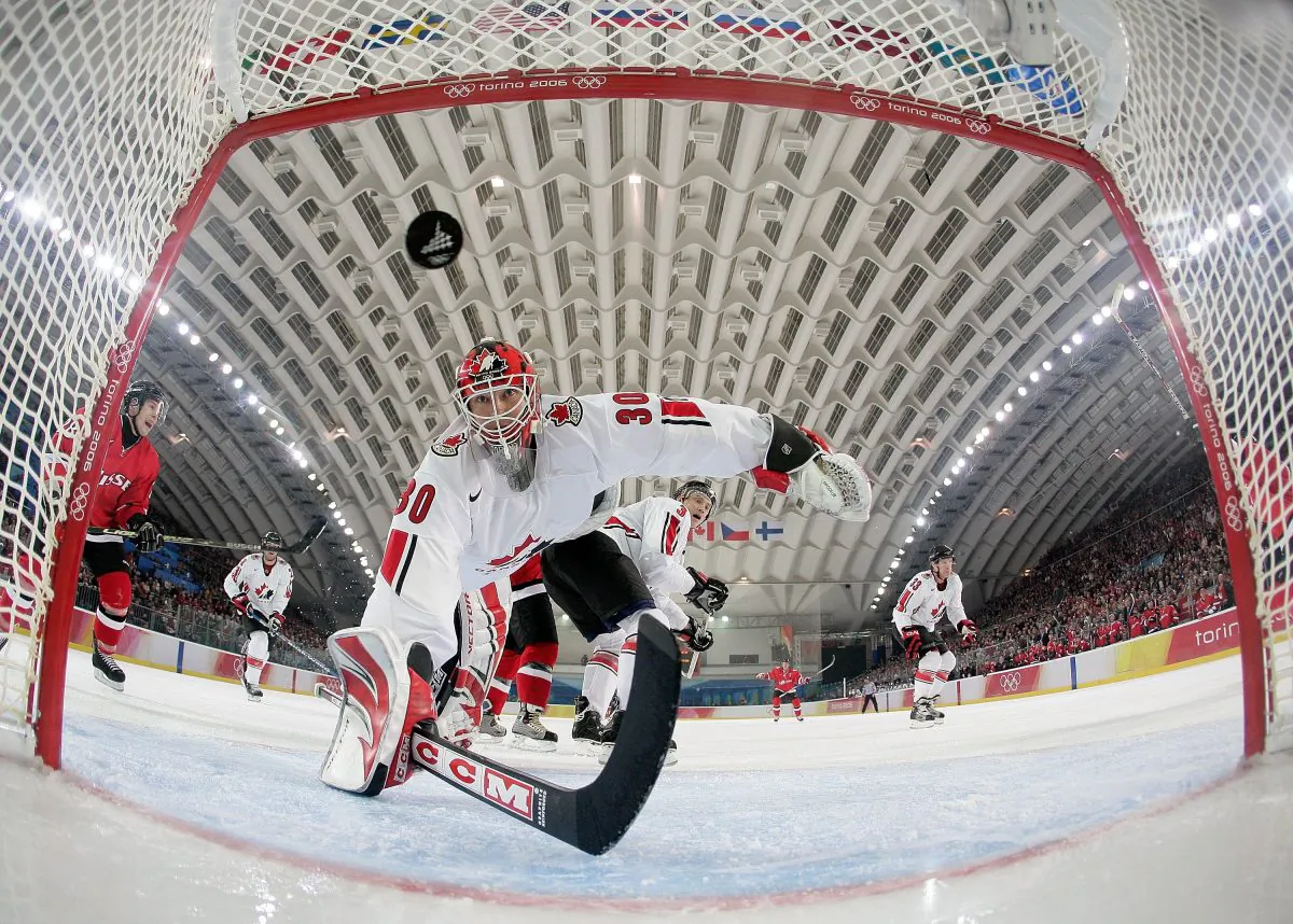 Canadian goalie Martin Brodeur sees a Swiss shot get past him. Switzerland beat Canada at the 2006 Olympics in Turin, Italy. (Elsa/Getty Images)
