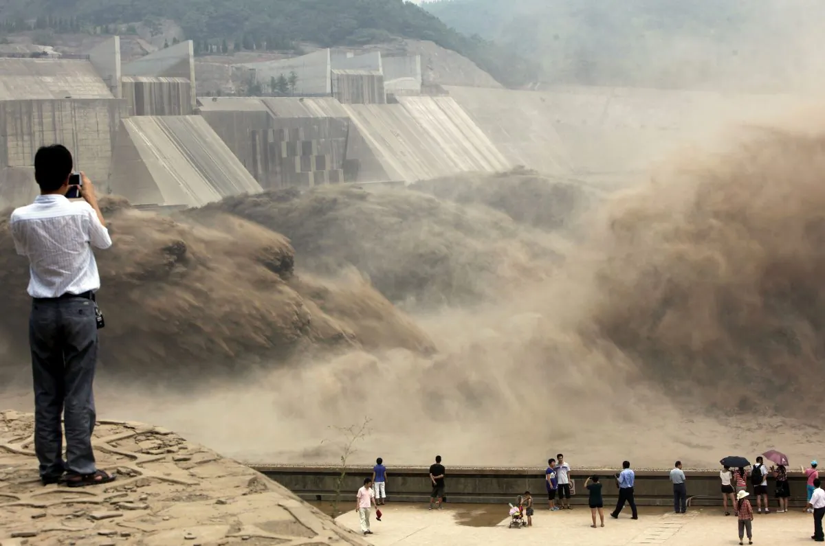 Giant gushes of water are released from the Xiaolangdi Dam to clear up the sediment-laden Yellow River and to prevent localized flooding, in Jiyuan, in central China's Henan Province on July 6, 2012. (STR/AFP/GettyImages)