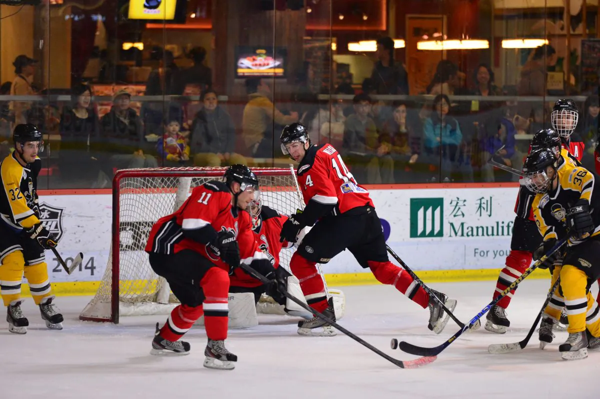 Warriors back in defense as they come under attack from the HK Tycoons in their CIHL match at Mega Ice on Saturday Feb 8, 2014. Warriors went on to win the game 11-4. (Bill Cox/Epoch Times)