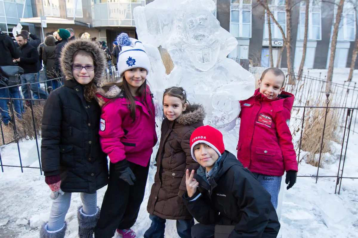 A newly made ice sculpture has already found some young fans. (DQC Photo)